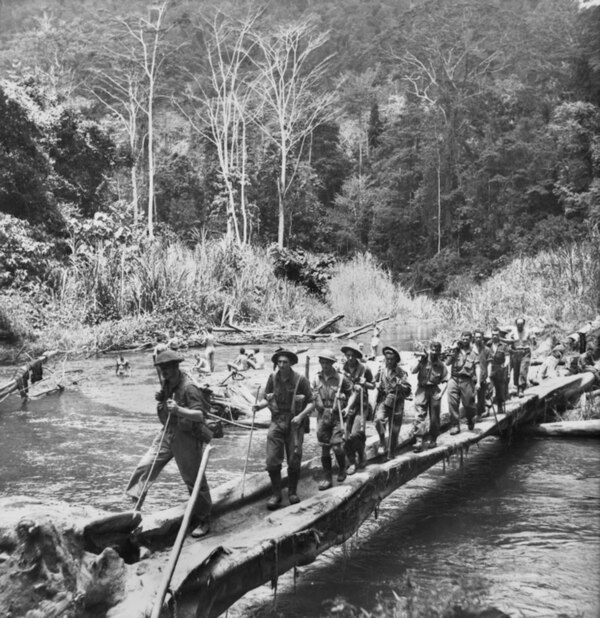 Men from the 2/25th Battalion cross the Brown River during a patrol in October 1942