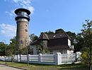 Water and electricity works with a former water tower, outbuildings and property fencing