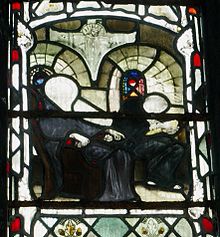 Stained glass at Gloucester Cathedral depicting Bede dictating to a scribe Bede dictating to a scribe.JPG