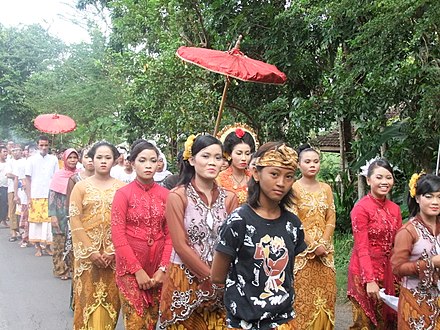 A bridal procession accompanied by live music in Lombok, Indonesia. According to the National Statistical Bureau of Indonesia, the mean age of marriage for women was 22.3 years in 2010, an increase on the 1970 average of 19 years; the corresponding figures for men were 25.7 years and 23 years respectively.[283]
