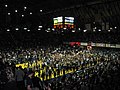 Students flood the court following the buzzer-beater victory over Gonzaga