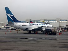 A WestJet Boeing 737-600 at LaGuardia Airport, May 2013. Scheduled service to the airport from WestJet began the previous year.