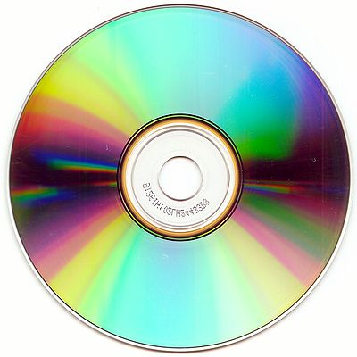 The bottom surface of a 12 cm compact disc (CD-R), showing characteristic iridescence.