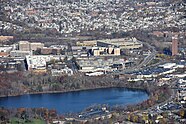 Aerial view of Cambridge Highlands in Cambridge, Massachusetts. Includes Alewife MBTA station and parts of Fresh Pond. Cambridge Highlands aerial, November 2015.jpg