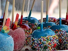 Blue and red candy apples, dipped in sprinkles and sugar Candy Apple (5819333319).jpg