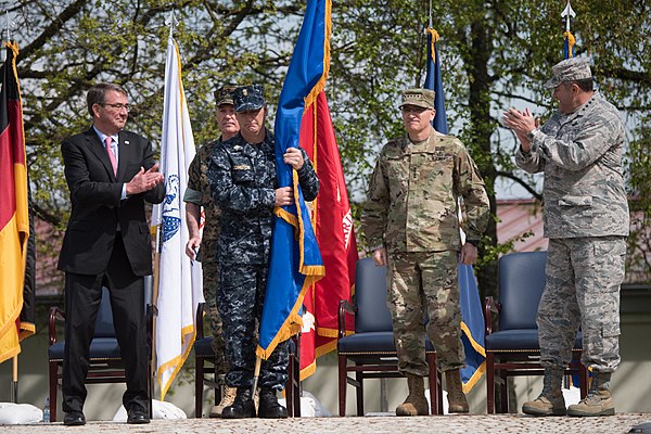 U.S. Secretary of Defense Ash Carter (far left), outgoing combatant commander Philip M. Breedlove (far right), chairman of the Joint Chiefs of Staff J