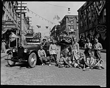 Chinese dance group with decorated car on South King Street in the 1920s