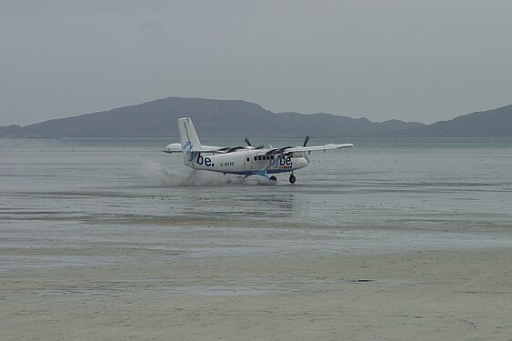 DHC6 takes off from tidal flats