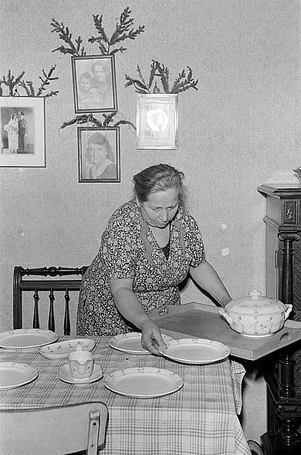 Setting the table for a family meal, Leipzig (1952)