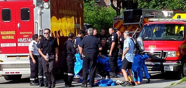 Toronto Fire Services personnel equipping hazmat suits at a hazardous materials incident in 2015