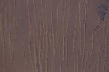 Large linear seif dunes in the Great Sand Sea in southwest Egypt, seen from the International Space Station. The distance between each dune is 1.5–2.5 km.