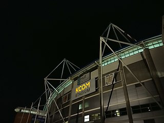 The KCOM Stadium is a multi-purpose facility in the city of Kingston upon Hull, England. The stadium was previously called the KC Stadium, but was renamed as part of a major rebrand by the stadium's sponsors, telecommunications provider KCOM, on 4 April 2016. Conceived in the late 1990s, it was completed in 2002 at a cost of approximately £44 million. The stadium is owned by Hull City Council and operated by the Stadium Management Company (SMC), who are looking to expand the stadium up to 32,000.