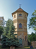 Water tower with weather vane