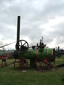 Preserved Marshall 6nhp single-cylinder portable engine, no. 87866, built 1936. This design has a 'colonial' boiler and a long firebox for burning logs. Marshall Portable Engine 87866 (GDSF 2007).JPG