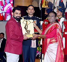 Shami receiving the Arjuna Award from President Droupadi Murmu in January 2024 Mohammed Shami Arjuna Award.jpg