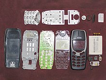 A disassembled Nokia 3310 showing various internal components Nokia 3310 disassembled (filtered) (no border).jpg