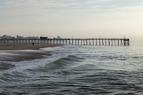 The beach and fishing pier at Ocean City, Maryland at first light