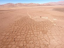 Patterned ground in the form of soil polygons located in the hyper-arid Atacama Desert. Patterned ground located in the Atacama Desert (Chile).jpg