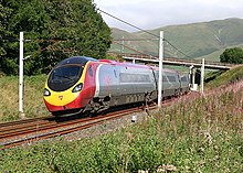 A Virgin Trains Pendolino tilting into one of the many curves on the northern part of the WCML. Pendolino at Beck Foot - geograph.org.uk - 358839.jpg