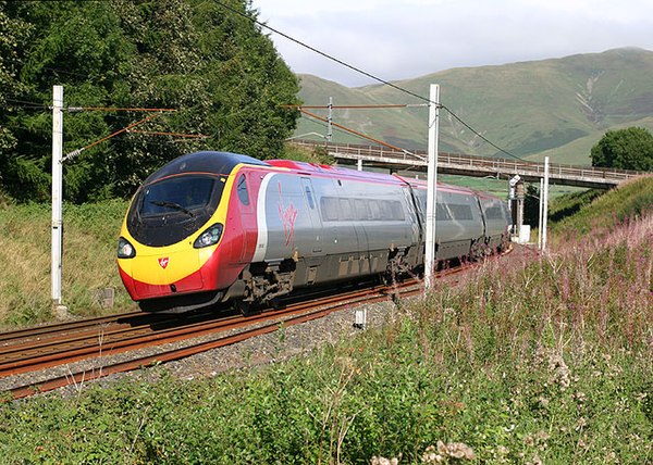 A Virgin Trains Pendolino tilting into one of the many curves on the northern part of the WCML.