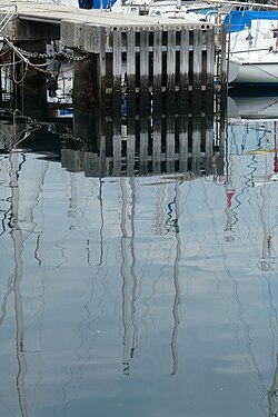 Pier reflection on the water, Trieste, Italy