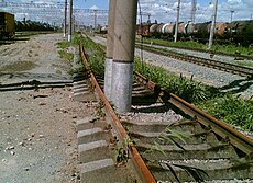 Poles inside rail lines.jpg