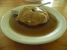 A poutine a trou smothered in maple syrup. Poutine a trous Village historique acadien.jpg