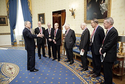 President George W. Bush speaks with National Medal of Science Laureates, White House, 2006. Dr. Norman E. Borlaug is second from left.