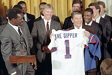 Simms at the White House following the Giants Super Bowl XXI victory. President Ronald Reagan with New York Giants football team.jpg