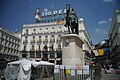 Puerta del Sol in Madrid with King Carlos III statue and Tio Pepe sign