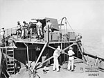 Thumbnail for File:QF 4 inch Mk IV gun recoiling on HMAS Wilcannia AWM 304887.jpeg