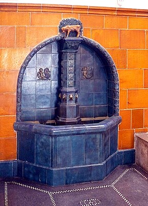 The orange-colored tiles in the town hall in Schneeberg, Saxony are made with a Uranium glaze Rathaus Schneeberg Brunnen 110430 (137).JPG