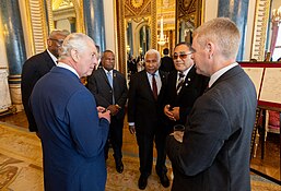 All fourteen governors-general and eight other realm prime ministers (pictured, left to right: Sir Rodney Williams, Sir Bob Dadae, Sir David Vunagi, Sir Tofiga Vaevalu Falani and Chris Hipkins) attended the coronation. Realms Lunch Coronation Event (52872692258).jpg