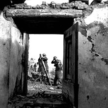 Personnel of the Saskatoon Light Infantry firing a 3-inch mortar, near Ortona, Italy, January 5, 1944 SaskatoonLightInfantryFireMortarOrtona1944.jpg