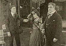 Davis (right) in The Strength of the Weak alongside Mary Fuller and Harry Hilliard