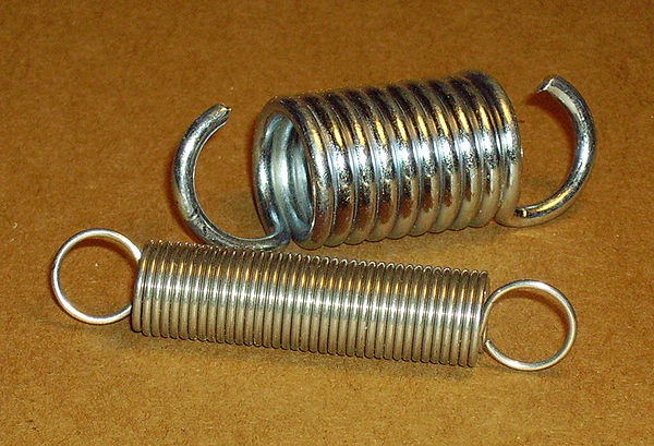 Helical coil springs designed for tension