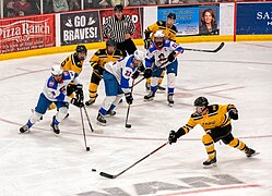 Marauders Hockey player races for the puck