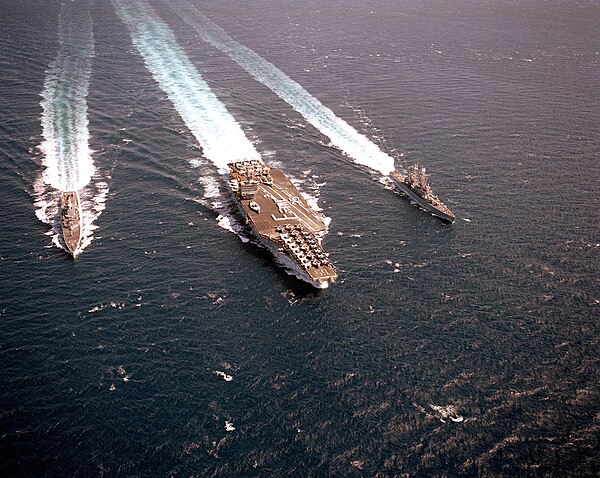 Truxtun (right) alongside Enterprise (center) and Arkansas (left) on a cruise commemorating the 25th anniversary of Operation Sea Orbit