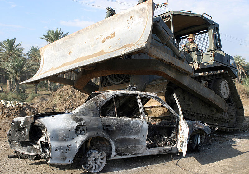 File:US Navy 041113-M-1250B-012 A U.S. Navy Seabee assigned to the 24th Marine Expeditionary Unit (MEU), compresses a car which will be placed inside a hole on a bridge in Lutafiyah, Iraq.jpg