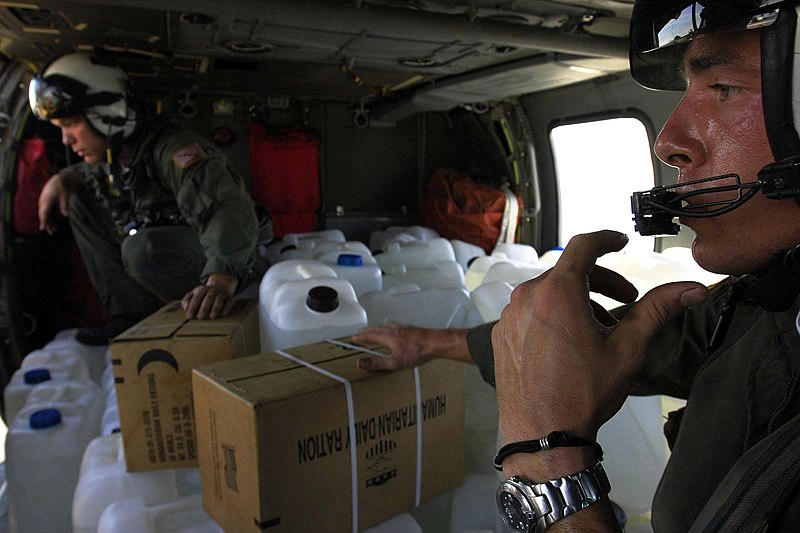 File:US Navy 050107-N-6074Y-066 Aviation Machinist's Mate Airman Gillies, right, speaks with the pilots of his MH-60S Knighthawk helicopter, while flying water and relief supplies to Banda Aceh on the island of Sumatra, Indonesia.jpg