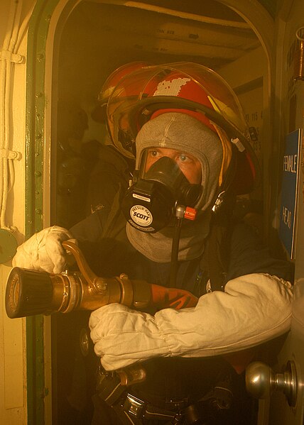 File:US Navy 060405-N-2541H-061 During a general quarters (GQ) fire drill the number one hoseman enters a ship's compartment to battle a class alpha fire.jpg