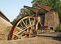 * Nomination Das Wasserrad mit dem Pumpwerk am Gradierbau III in Bad Nauheim. Von den ehemals 8 über das gesamt Stadtgebiet verteilten Wasserrädern sind heute noch zwei erhalten. Dies Wasserrad am Ludwigsbrunnen und das Schwalheimer Rad. Die Wasserräder von (Bad) Nauheim zählen zu den größten ihrer Art in Europa. Das Wasserrad am Ludwigsbrunnen ist erst kürzlich von einer Fachfirma saniert worden. By User:Muehlenbernd --Atamari 00:16, 1 November 2015 (UTC) * Promotion Good quality. --Hubertl 00:38, 1 November 2015 (UTC)