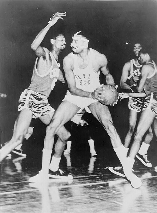 Bill Russell (off ball) was a member of one of the first dynasties in the NBA, winning eight straight titles while contending against Wilt Chamberlain