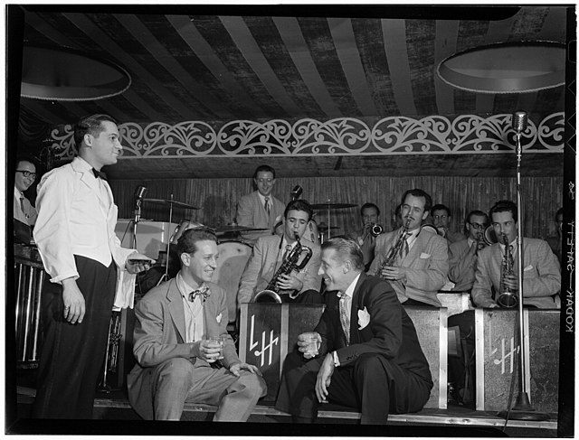 Sam Donahue and orchestra, Kenton on right, New York, 1946