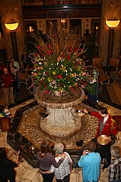 Duckmaster giving the ducks a feeding 20150521 The Peabody Hotel lobby and ducks (6).JPG