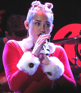 Cyrus performing at the 2013 Jingle Ball in Tampa, FL