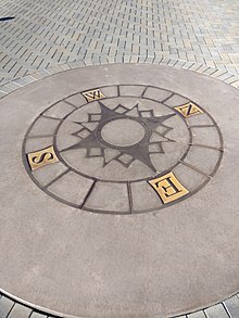 A 16-point compass rose on the grounds of a library serves both as a pedagogical device and public art. BownLibrary!CompassRose.jpg