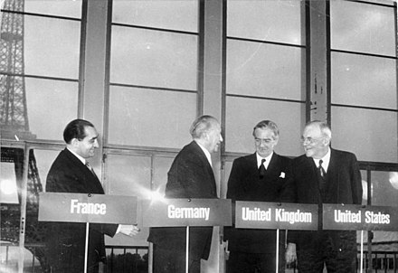 Negotiations in London and Paris in 1954 ended the allied occupation of West Germany and allowed for its rearmament as a NATO member.