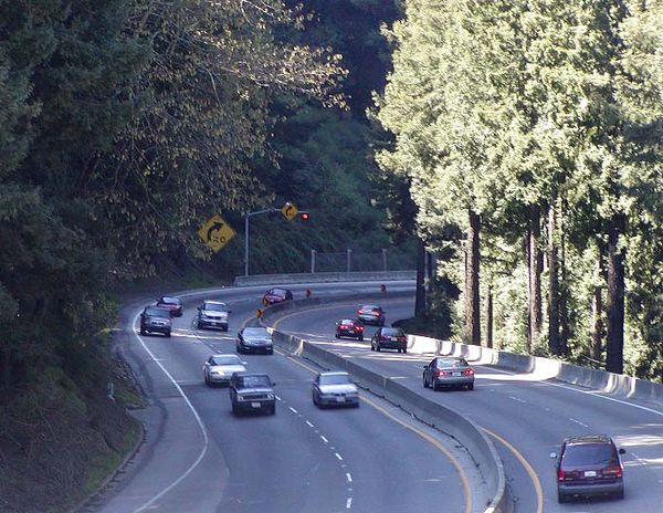 Looking downhill from the Summit Road overpass; brake lights can be seen as cars slow down before the curve known as "Valley Surprise".