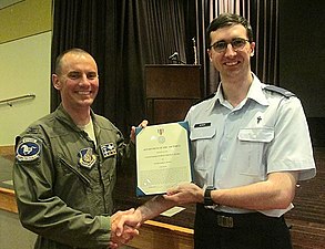 Osan AB Vice Commander Col. Cary Culbertson Presenting the Commander's Public Service Award to Ch James Moser, USAFR Ch. James Moser, USAFR Award Presentation.jpg